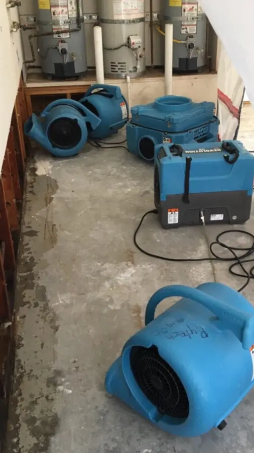 High-volume air movers running on a floor in Encino