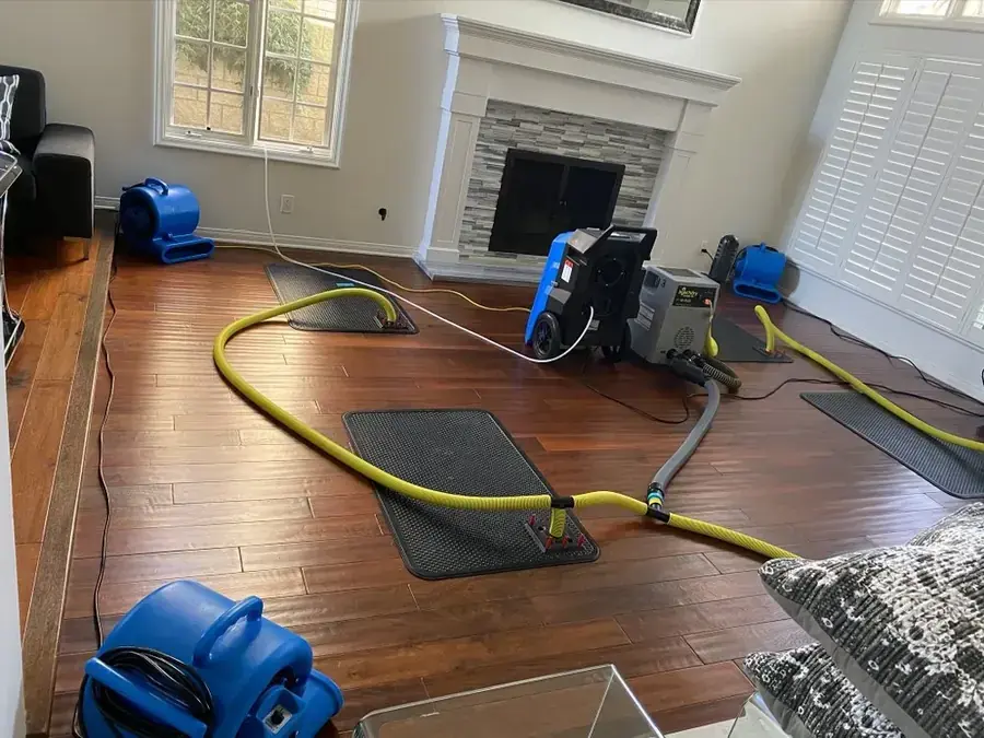 Air movers and a dehumidifier drying an Encino, CA home interior
